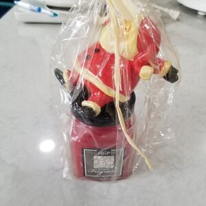 HGP Candle with santa figure who sits on cover apples & brown sugar scent nos